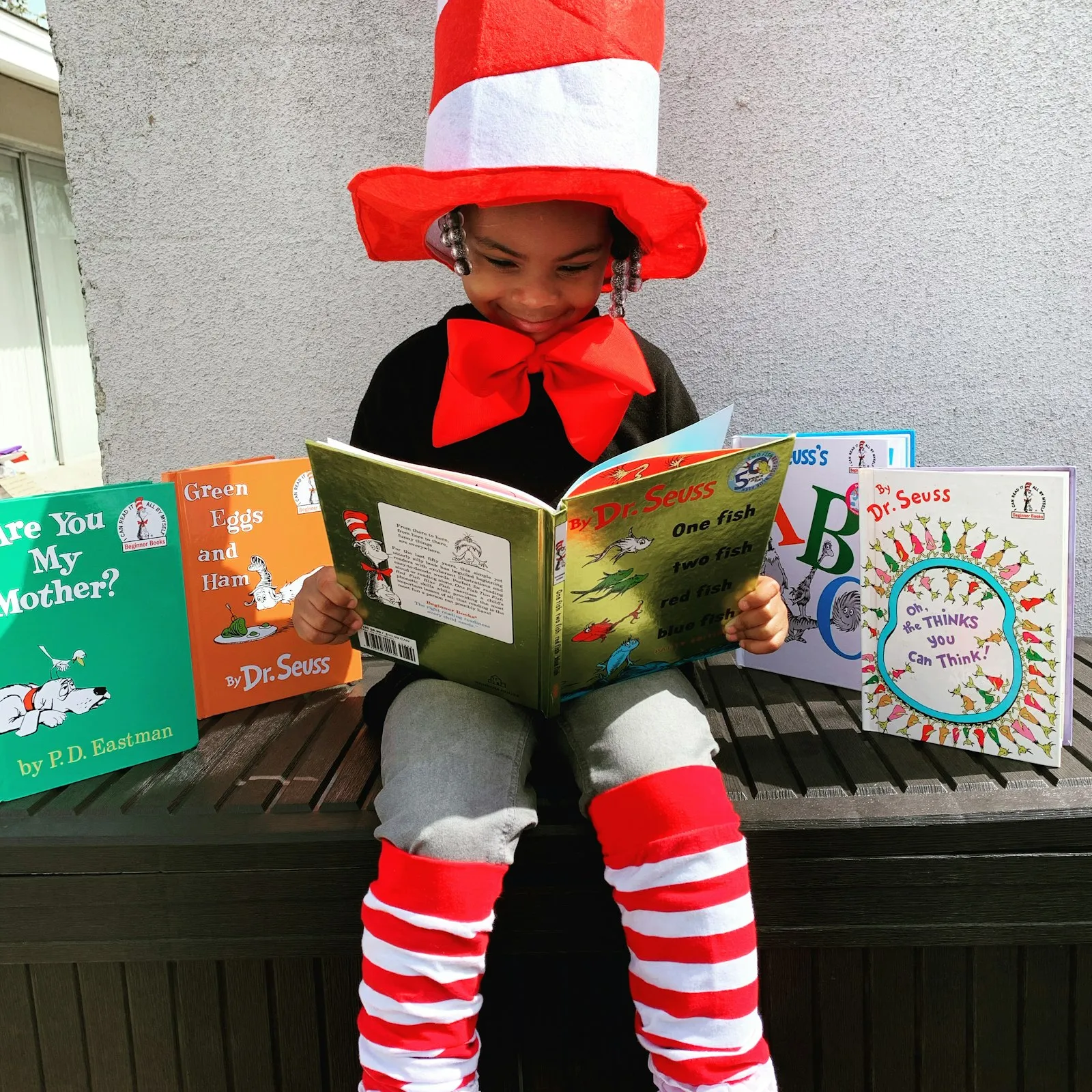 A child reading a picture book during story time